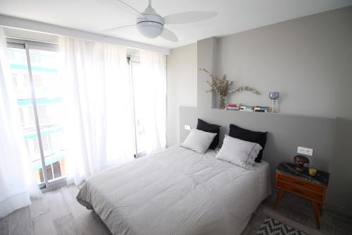 A bed or beds in a room at Apartamento Mediterraneo