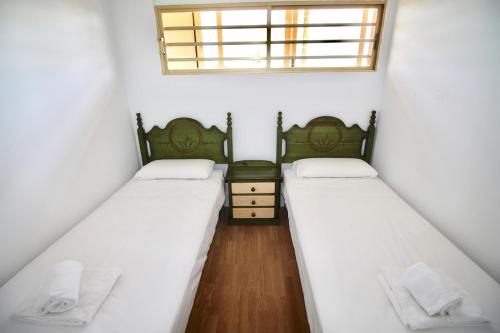 A bed or beds in a room at Apartamento El Tridente