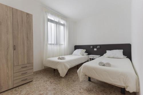 Ένα ή περισσότερα κρεβάτια σε δωμάτιο στο Apartamento Gaviota