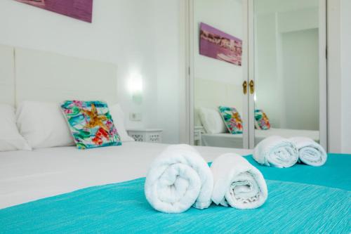 Giường trong phòng chung tại Apartamento Villa Cancun