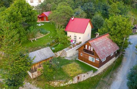 an aerial view of a house with a red roof at Casa La LEPE in Roşia Montană