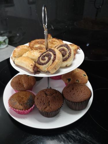 a three tiered plate of pastries and cupcakes at Lossiemouth House in Lossiemouth