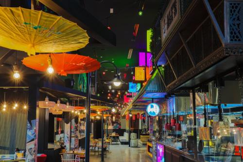a store with umbrellas hanging from the ceilings at Dusit Thani Dubai in Dubai