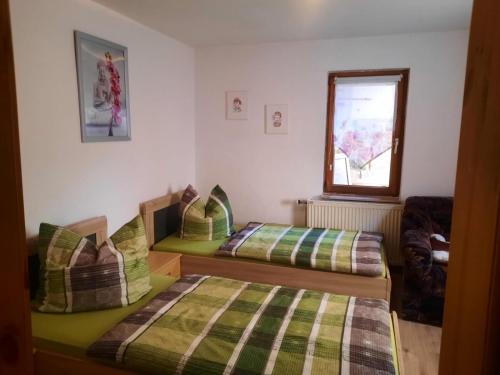 Postel nebo postele na pokoji v ubytování Ferienwohnung Schlothauer 1