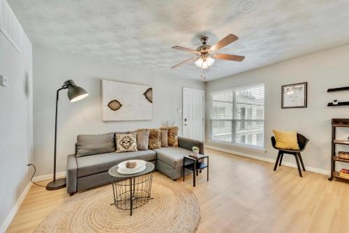 a living room with a couch and a ceiling fan at Global Cup The Dallas Vibe and Free Arboretum Tickets in Dallas