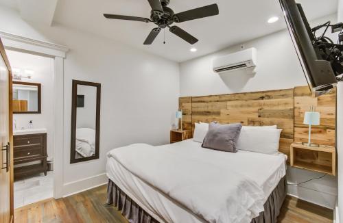 a bedroom with a bed and a ceiling fan at 493 King Two Bedroom Suites in Charleston