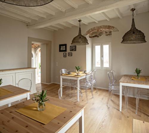 a kitchen and dining room with a table and chairs at Podere GIUSTI in Reggello