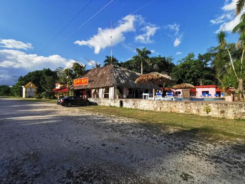 a building on the side of a road at Hotel Doralba Inn Chichen in Chichén-Itzá
