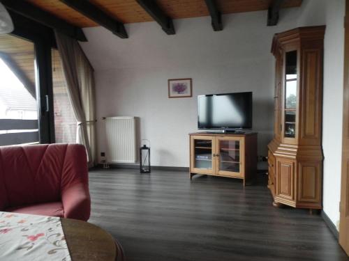 a living room with a flat screen tv on a cabinet at sonja in Ditzum