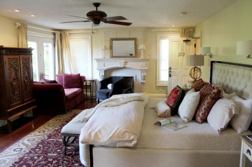 a living room with a couch and a fireplace at Norfolk Guest House Inn in Guelph