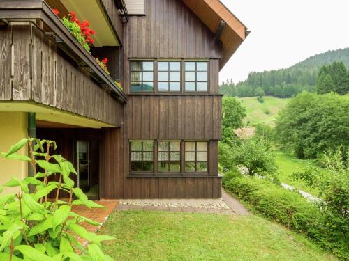 a house with a view of the yard at Cosy apartment in Bad Rippoldsau with terrace in Bad Rippoldsau