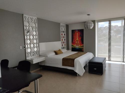 Ліжко або ліжка в номері Hotel Andinos Plaza Florencia