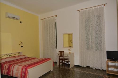 Кровать или кровати в номере Family Hotel Balbi