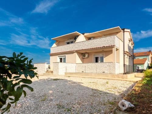 a villa with a view of a house at Lavish Apartment in Omi alj with Rooftop Terrace in Omišalj