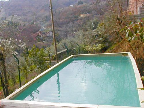 a swimming pool with a view of a mountain at Belvilla by OYO Conca oro in Marliana