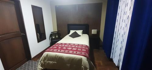 
A bed or beds in a room at Hostal Jerian
