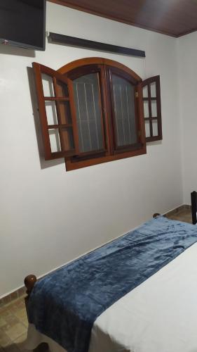 En eller flere senger på et rom på Cantinho da Vovó