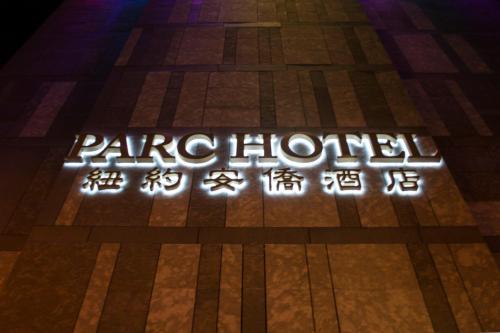a neon sign that says parlorled on a floor at The Parc Hotel in Queens
