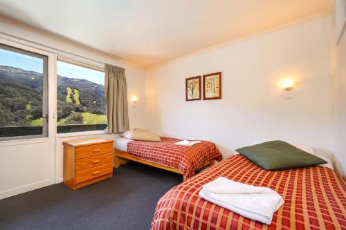 Letto o letti in una camera di Kasees Apartments & Mountain Lodge
