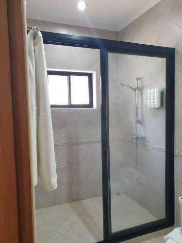 a shower with a glass door in a bathroom at View Talay Holiday Resort in Jomtien Beach