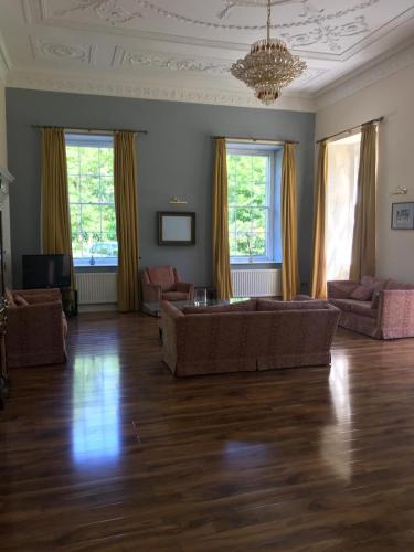 a living room with a couch and two couches at Ellison Hall in Hebburn-on-Tyne