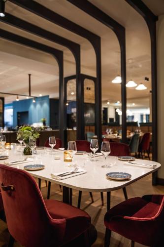 a table in a restaurant with wine glasses on it at Radisson Blu Royal Viking Hotel, Stockholm in Stockholm