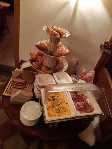a table with a tray of food on top of it at Landhaus Lenzenhof in Reit im Winkl