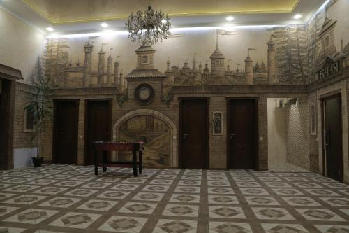 a large room with a chandelier on the wall at Hotel Ashad in Svalyava
