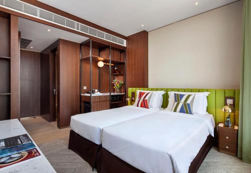 a bedroom with a large white bed in a room at Hotel 1936 in Hong Kong