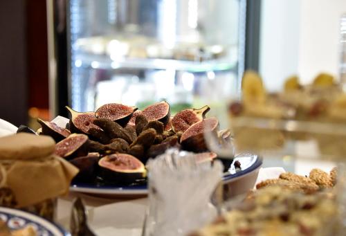 a table with a plate of food on a table at BUSINESS HOTEL SFAX in Sfax