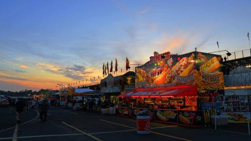 a carnival fair with people walking in a parking lot at Holiday Inn Express Tampa-Brandon by IHG in Brandon
