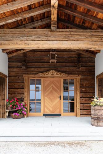 a wooden garage with a wooden roof at Kramerl in Bruck an der Großglocknerstraße