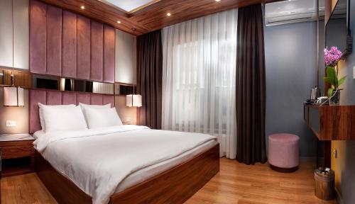 Posteľ alebo postele v izbe v ubytovaní Vitabella Suites