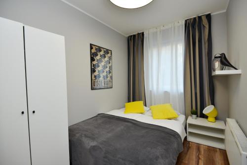Postel nebo postele na pokoji v ubytování Apartamenty TOP Garbary