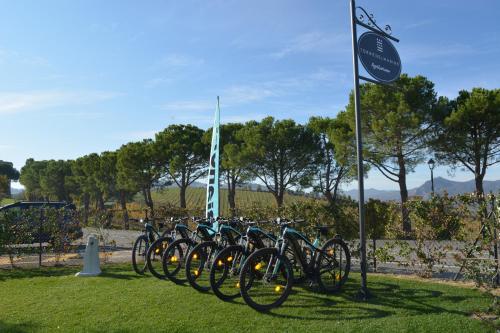 a row of bikes parked next to a sign at Agriturismo Torre del Marino in Brisighella