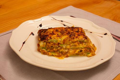 a piece of food on a white plate on a table at Agriturismo Torre del Marino in Brisighella