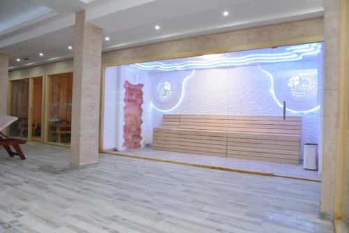 a large wall with a large bench in a building at Dream Milmari L12 Apartman in Kopaonik