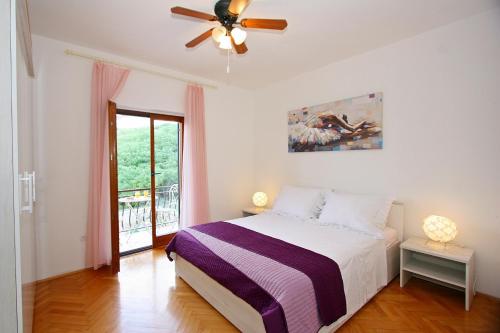 Postel nebo postele na pokoji v ubytování Apartments Omo 1