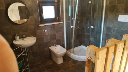 a bathroom with a sink and a toilet and a shower at "il Casaletto" Agriturismo Moderno, Vista Panoramica e Cibo Spettacolare- Scurcola Marsicana in Scurcola Marsicana