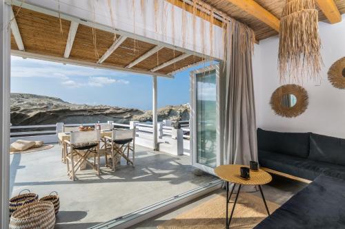 a living room with a view of the ocean at AQUA HOUSE in Pachaina
