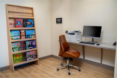 an office with a desk with a computer and a chair at Candlewood Suites - Las Vegas - E Tropicana by IHG in Las Vegas