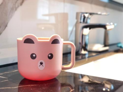 a cup with a bear face on a kitchen counter at Crowne Plaza Foshan Nanhai-an IHG Hotel-Free Shuttle Bus to Canton Fair in Guangzhou