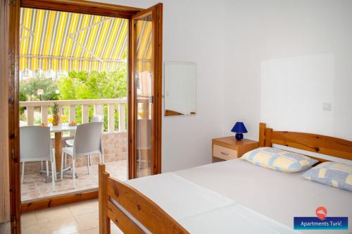 Posteľ alebo postele v izbe v ubytovaní Apartments Turić
