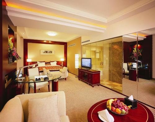 TV a/nebo společenská místnost v ubytování Inn Fine Hotel