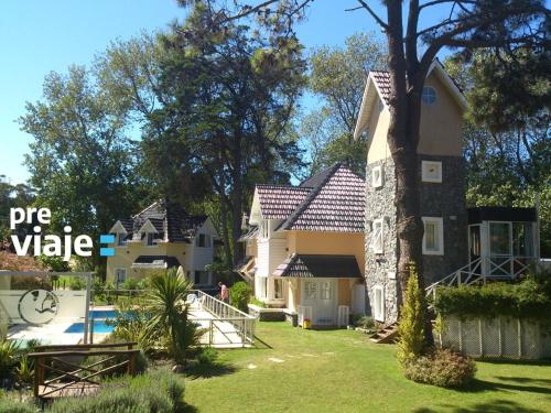 a large house with a pool in front of it at Lahuen-co Paraje de Mar in Valeria del Mar