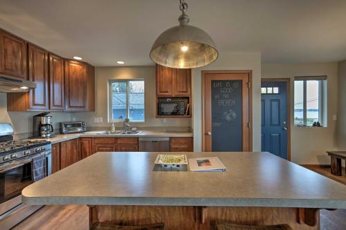 a kitchen with a large island in the middle of it at Birch Bay Abode Crabbing, Boating and Golfing! in Blaine
