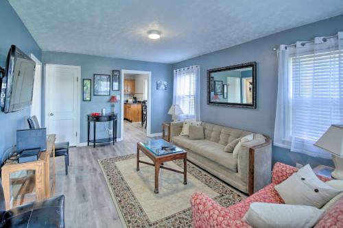 a living room with a couch and a table at Steps to Speedway - Great for Race Fans! in Speedway