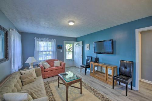 a living room with a couch and a tv at Steps to Speedway - Great for Race Fans! in Speedway