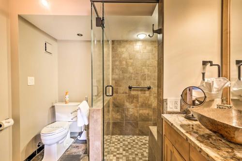 a bathroom with a shower and a toilet and a sink at Ski and Hike Mtn-View Condo in Silverthorne! in Silverthorne