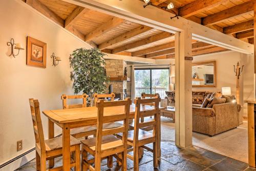 a dining room with a wooden table and chairs at Ski and Hike Mtn-View Condo in Silverthorne! in Silverthorne